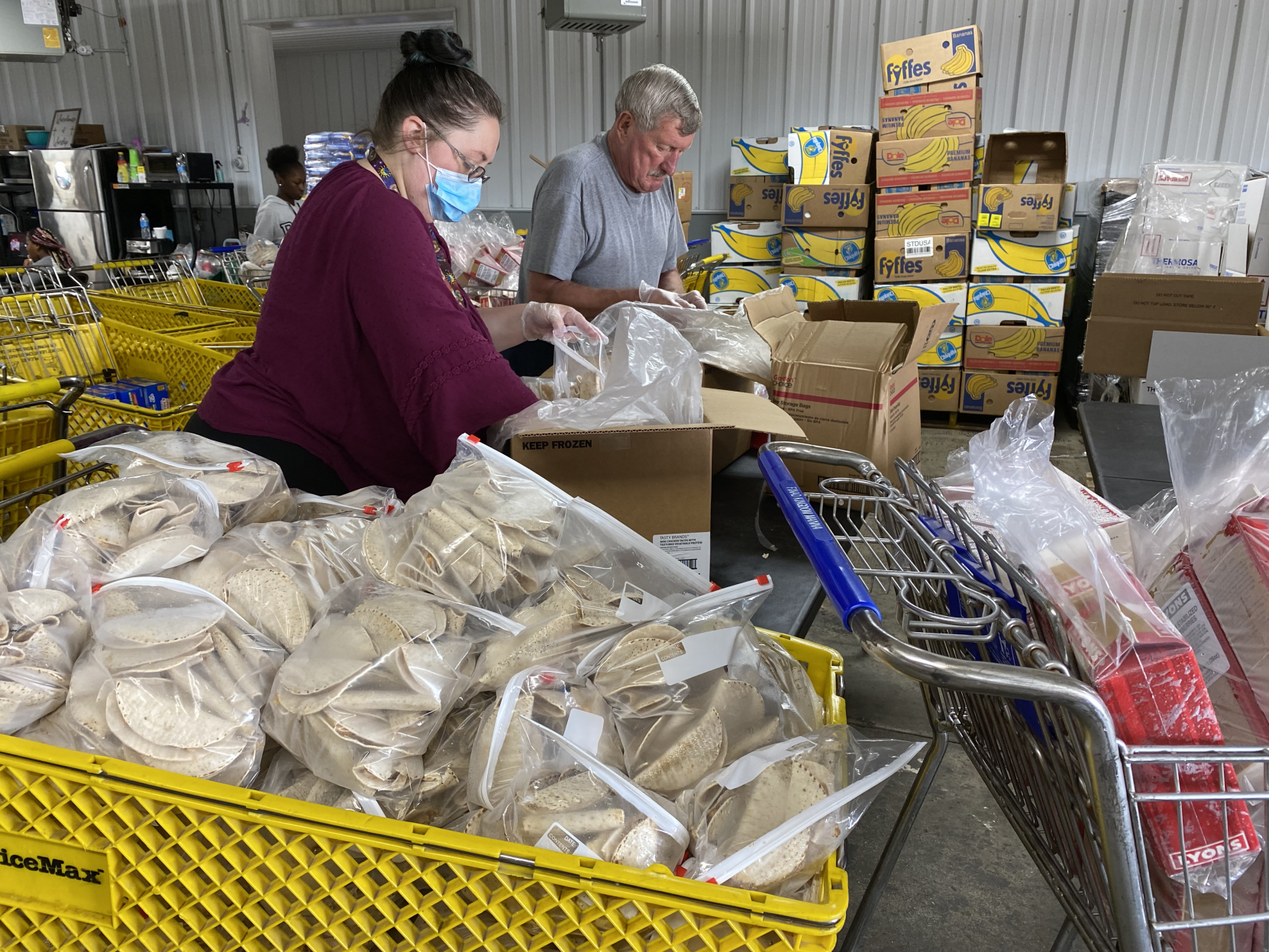 Volunteers prepare shopping carts